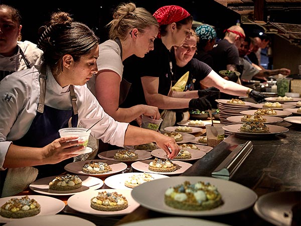 Chefs preparing meals at BOKA Group's 90/90 dinner event (Photo by Maureen Sanderson)